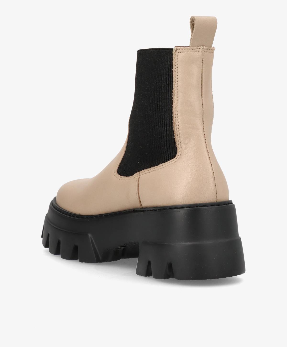 Beige støvle med sort elastisk sidepanel og tyk sort sål.
