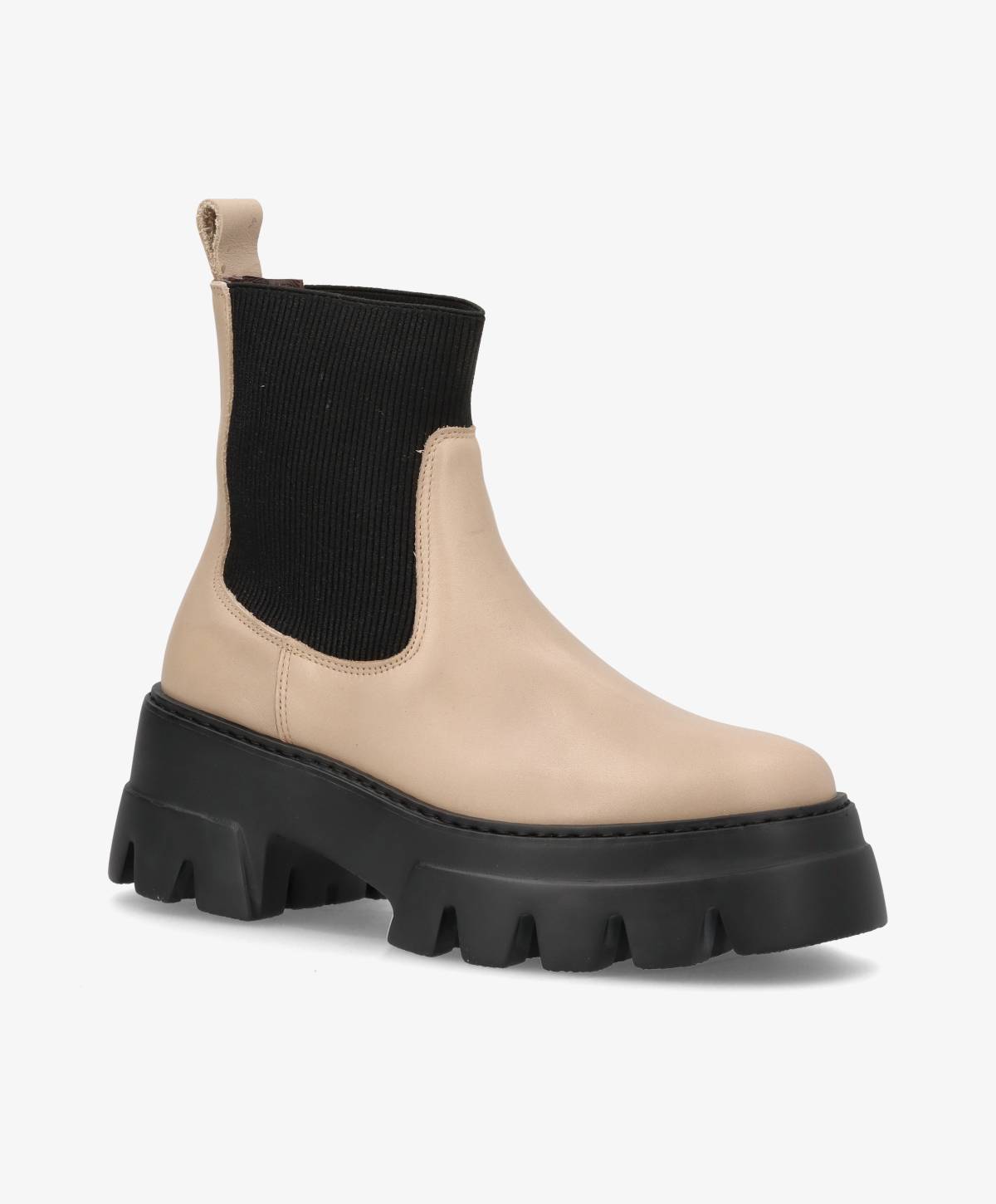 Beige støvle med sort elastisk skaft og tyk sort sål.
