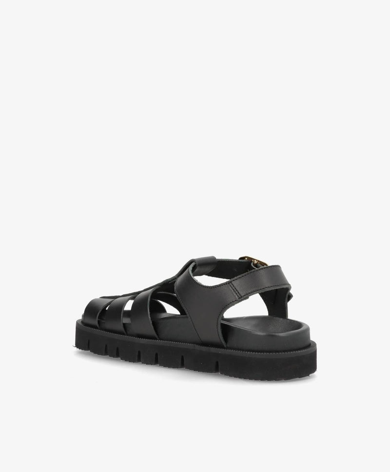 Sort damesandal med remme og tyk sål, set fra siden.