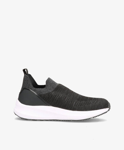 Sort slip-on herresko med hvid sål og grå detaljer, set fra siden.