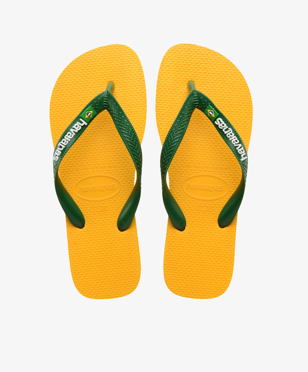 Gule Havaianas slip-ins med grønne remme, logo og brasiliansk flag.