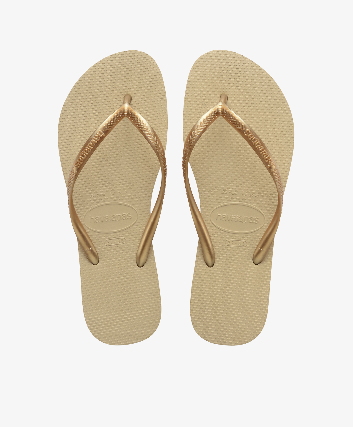 Beige Havaianas slip-ins med remme i metallisk look.